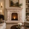Baroque cantera stone fireplace with carved shell and acanthus in an elegant family room