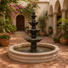 Colonial cantera fountain displayed in a Mediterranean courtyard with elegant architecture.