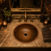 Rimmed mexican round copper sink showcased in a boutique restaurant wash area adding artisanal depth and copper character