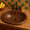 Longhorn mexican copper bathroom sink displayed in a Southwestern kitchen surrounded by earthy tones and artisan décor