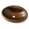 Angled view of oval copper bathroom sink with sculpted bowl curvature
