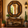 Handmade octagonal tin mirror with colorful talavera tiles in a Mexican entryway