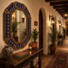 Octagonal decorative tin mirror with moon talavera tile frame installed in a boutique hotel corridor with artisan furnishings