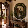 Decorating octagonal lizard talavera tin mirror in a rustic hacienda entryway wall