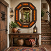 Octagonal decorative dark brown tin mirror with orange talavera lizard tiles in a rustic hacienda entryway with warm Mexican accents
