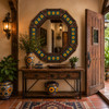 Octagonal tin mirror with sunflower talavera tile frame in rustic entryway