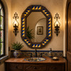 Octagonal decorative tin mirror with blue yellow talavera tiles beside wrought iron sconces