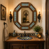 Octagonal decorative Mexican tin mirror with colorful talavera tiles in powder room