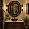 Handmade octagonal Mexican mirror with blue floral tiles in elegant powder room