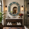 Decorative octagonal tin mirror with colorful talavera tiles in boutique hotel bathroom