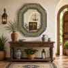 Rustic octagonal tin mirror with talavera accents styled in Mediterranean interior space