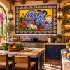 Mexican tile mural blue talavera tableware featured in a Mediterranean kitchen with tile decor.