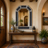Handcrafted Tin Mirror with Lizard Talavera Tile Frame in a Spanish Revival hallway