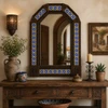 Dark Brown Tin Mirror with Blue Talavera Tile Frame above a rustic wood console table