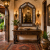 Handcrafted arch tin mirror with colorful talavera tile border in rustic hacienda entryway