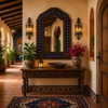 Handcrafted arch tin mirror with talavera lizard tiles in a hacienda style hallway