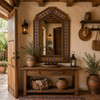 Handcrafted arch tin mirror with talavera floral tiles in a rustic hacienda hallway entry