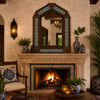 Handcrafted arch tin mirror with blue talavera floral tiles over colonial fireplace mantel