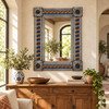 Talavera tile mirror above a handcrafted wood sideboard against textured plaster with ceramic accents