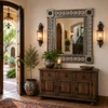 Hacienda style tin mirror with orange talavera tiles in a spanish colonial house entry above rustic console table
