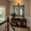 Mexican Metal Frame Tile Mirror Blue Floral Pattern on a stair landing of a tupical American house in suburbs