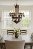 Vintage style wrought iron hanging chandelier in a transitional american suburban dining room