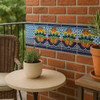 Talavera tile colorful scroll floral border design decorating an outdoor patio wall with colonial elegance