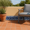 Talavera tile cobalt scroll border classic design decorating an outdoor patio wall with colonial Mexican charm