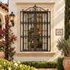 Renaissance wrought iron window guard with decorative crest on a Spanish colonial home