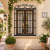 Forged iron window guards with symmetrical scrollwork design in a charming colonial courtyard