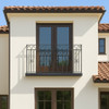 Wrought iron balcony railing with arched and twisted bars, visualization of the balcony installed on a house