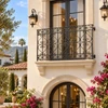 Spanish Revival wrought iron balcony guard railing featured on a boutique hotel exterior facade