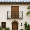 Wrought iron balcony railing in Spanish Colonial design installed on a second story hacienda style house