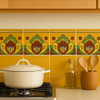 Mexican talavera tile yellow green heart border installed along a kitchen backsplash adding rustic Mexican charm