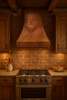 Copper vent hood with rooster  in a farmhouse kitchen