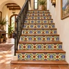 Talavera Mexican tile blue floral cross displayed on decorative stair risers in a rustic home