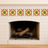 Mexican talavera tile green medallion framing a classic hacienda fireplace with earthy decorative detail