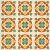 Mexican talavera tile green medallion shown in a 9-tile arrangement with light grout lines