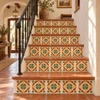Mexican talavera tile green medallion decorating stair risers in a Spanish-style interior.