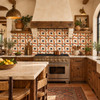Terracotta border talavera Mexican tile in a Spanish Revival kitchen with plaster and wood.