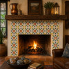 Mexican talavera tile in yellow and blue floral framing a rustic fireplace with vibrant color.