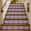 Stair risers decorated with lavender talavera tiles with a hand-painted daisy motif