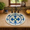 Talavera bathroom sink blue quatrefoil placed on a kitchen counter bringing clean geometric design to a warm interior