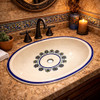 Minimal talavera floral ring bathroom sink featured in a restaurant restroom with refined handcrafted details