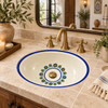 Minimal talavera floral ring bathroom sink in modern hacienda bath with natural wood and warm decor