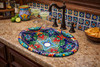 Talavera ornate oval bathroom sink featured in a kitchen bar setting with classic Mexican ceramic accents