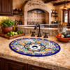 Talavera floral lattice mexican bathroom sink installed in hacienda kitchen with stone countertop and wood cabinetry