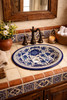 Cobalt floral talavera bathroom sink featured in a house bathroom showcasing handcrafted Mexican design