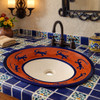 Mexican lizard talavera bathroom sink used in a Spanish Revival bathroom highlighting artisanal ceramic details