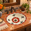 Mexican bathroom sink red bird in a Mexican hacienda bath with colorful tile accents